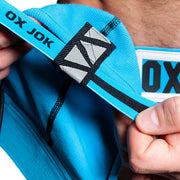 Oxjok Slingjock - Upthrust Slider Jockstrap - Ingebouwde Cockring - Met opbergvakje - Pool Blue-laced-up.nl