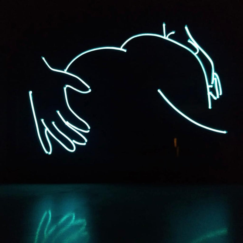 Wall sign with illuminated tekst FROM BEHIND